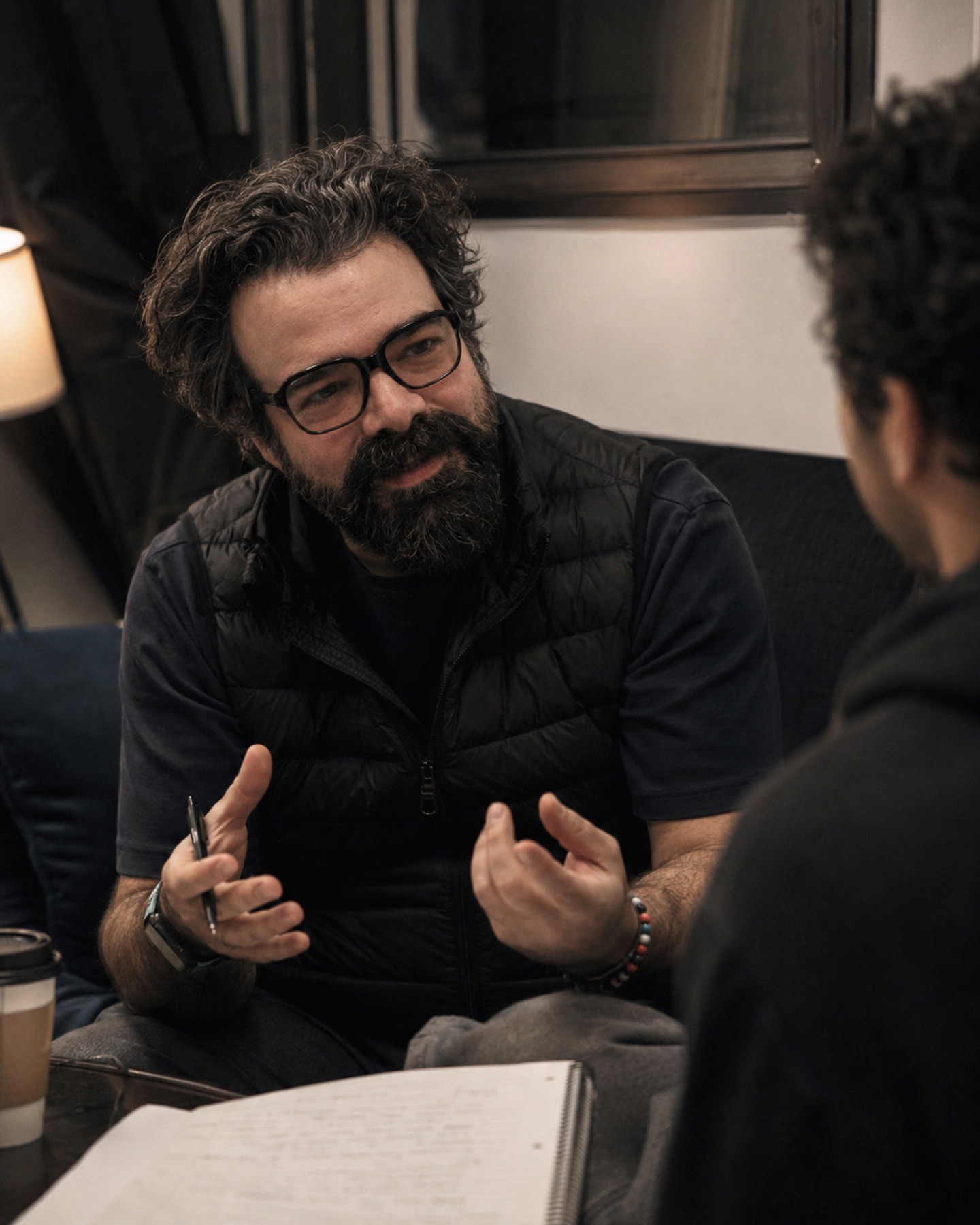 Rob Adler coaching an actor in rehearsal